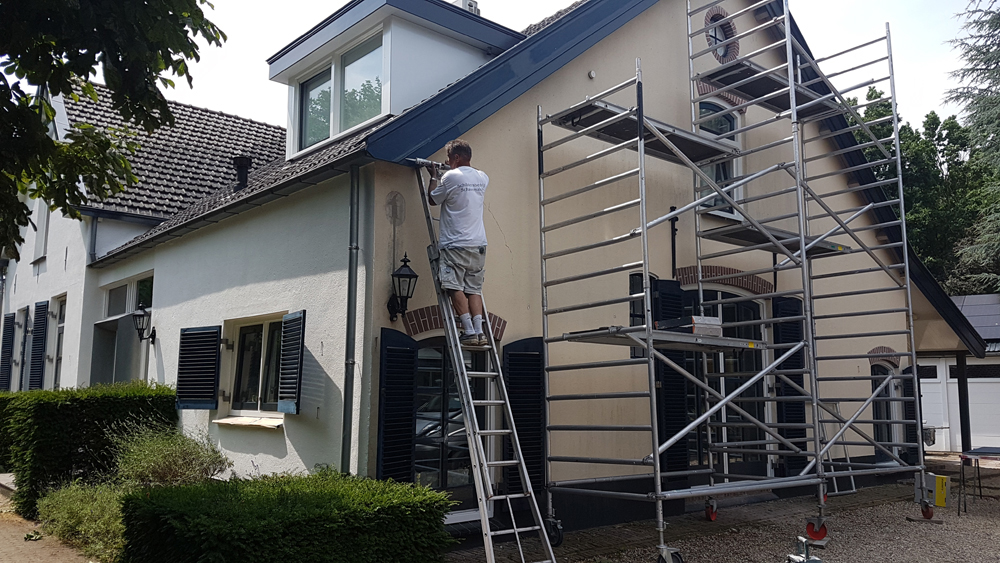 Schilderwerk aan een boerderij door Schavemaker